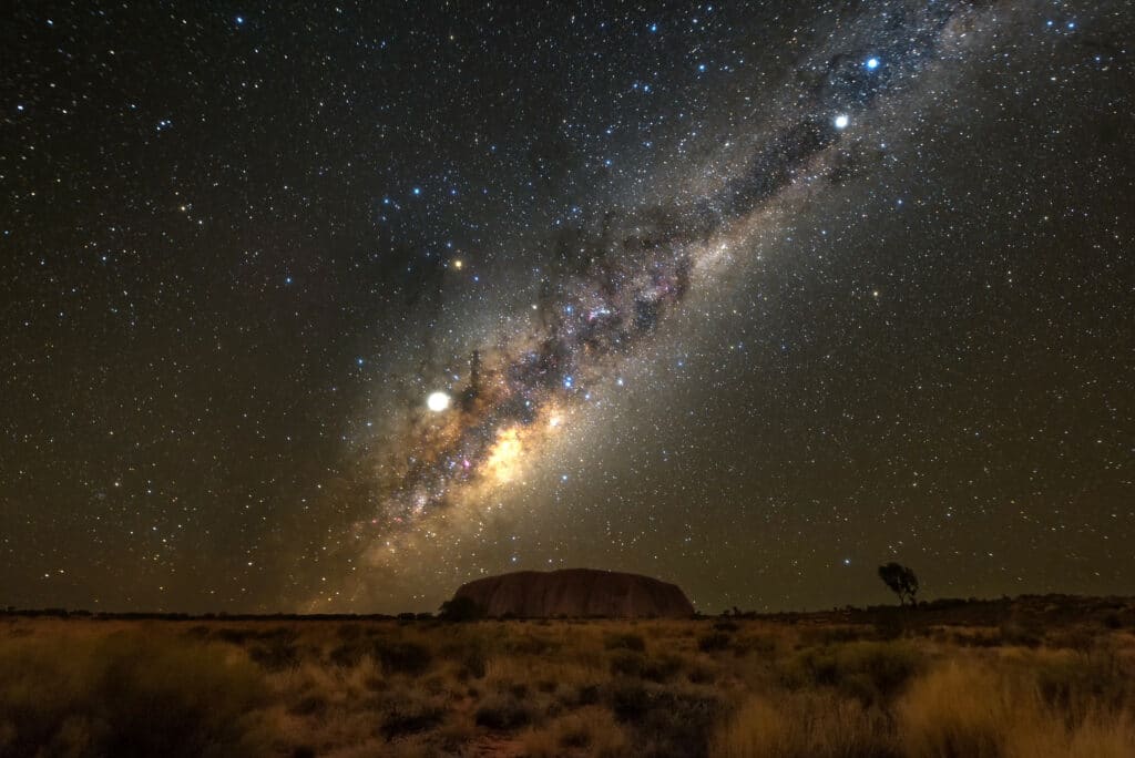 Uluru under the night sky. 13 Day Australian Highlights Tours