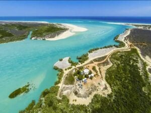 Aerial view of Willie Creek near Broome, showing winding turquoise waters, mangrove forests and sandy channels on the Kimberley coast.