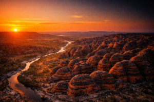 >Bungle Bungle Range at sunset in Purnululu National Park, Kimberley Western Australia Aerial view of the Bungle Bungles glowing orange and black at sunset, Kimberley WA